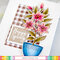 Potted Lily with plaid background