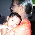 Tired Disha in paternal Granny's arms