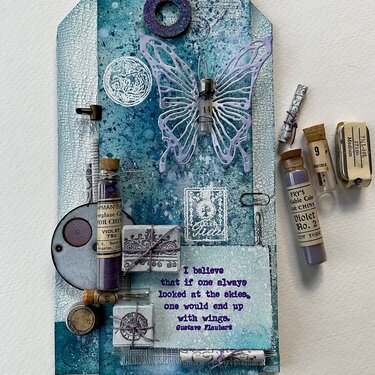 Mixed media tag with pocket watch parts. 