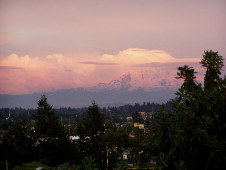 Strawberry shortcake sunset reflecting on the clouds over Mt. Rainier